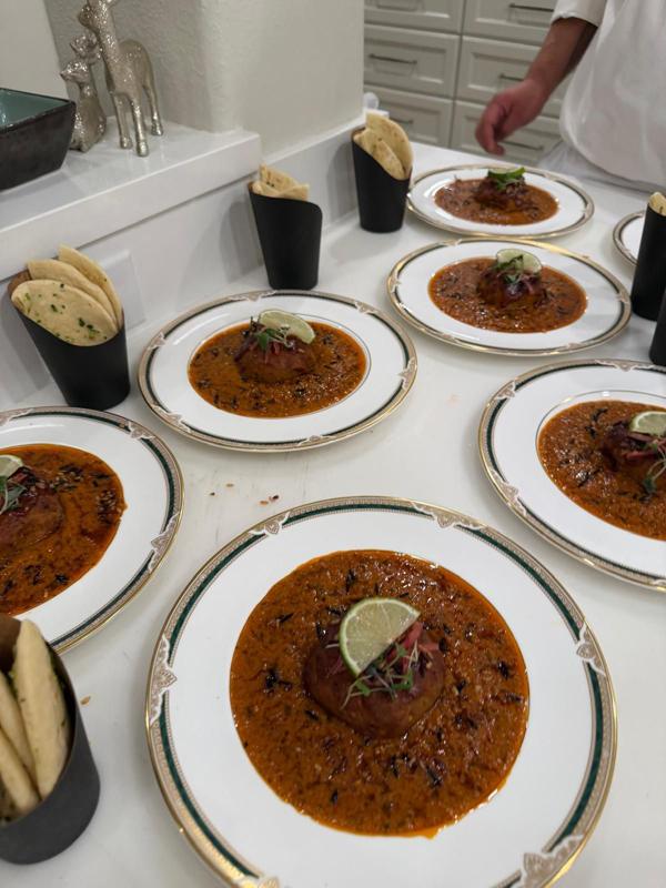 Courses plated in a row for a physician group dinner