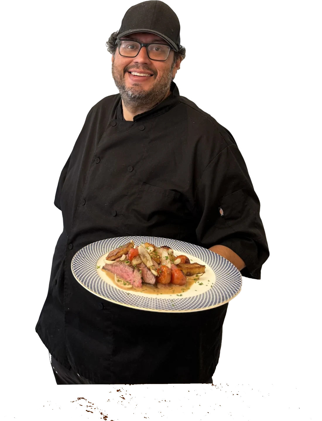 Chef Parag smiling and presenting a plated course