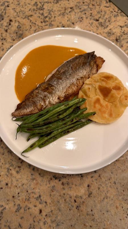 Plated fish course with asparagus