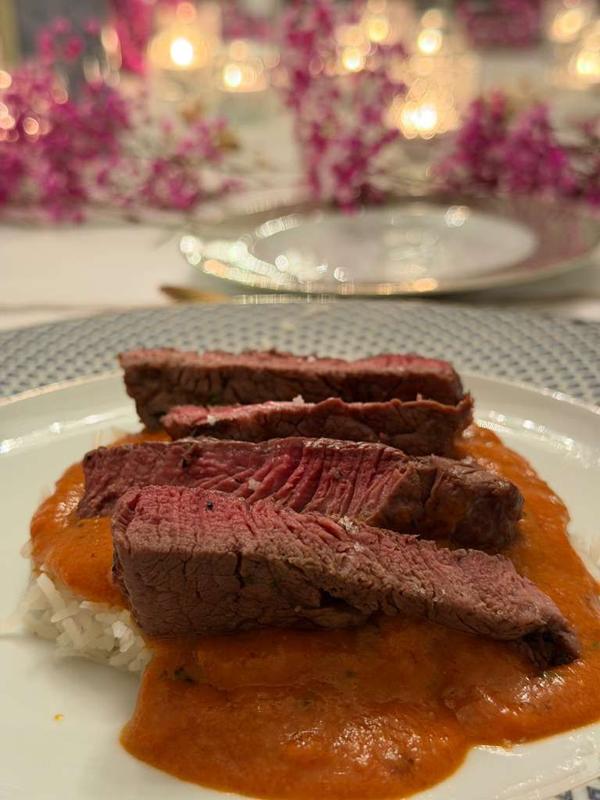 Sliced steak course over makhani sauce