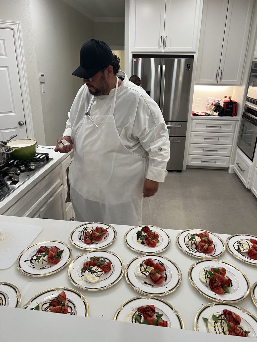 Chef Parag composing a row of tasting plates while designing a menu